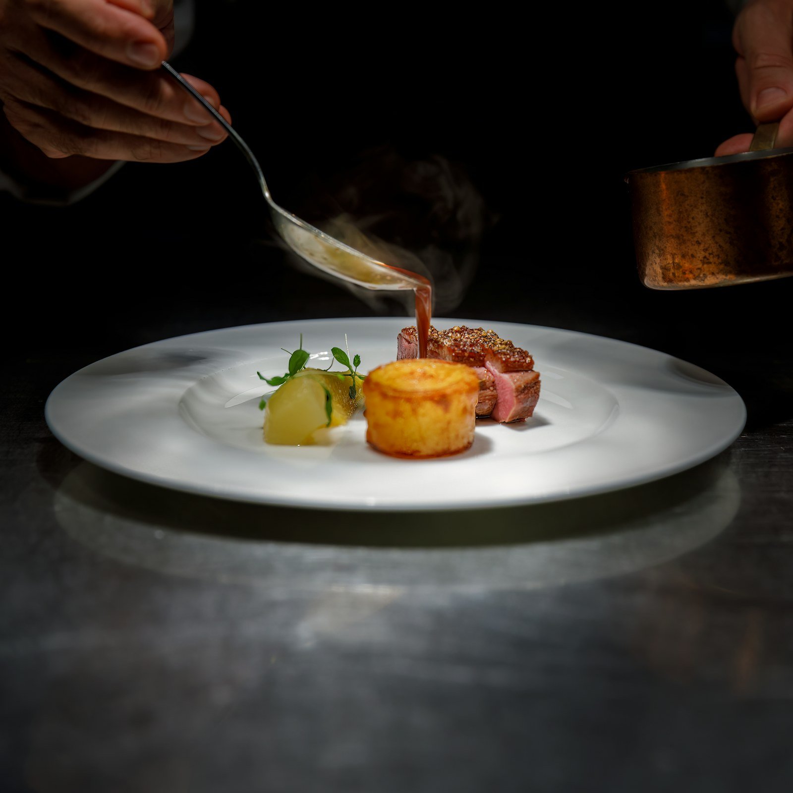 Chef finishing a fine-dining plate