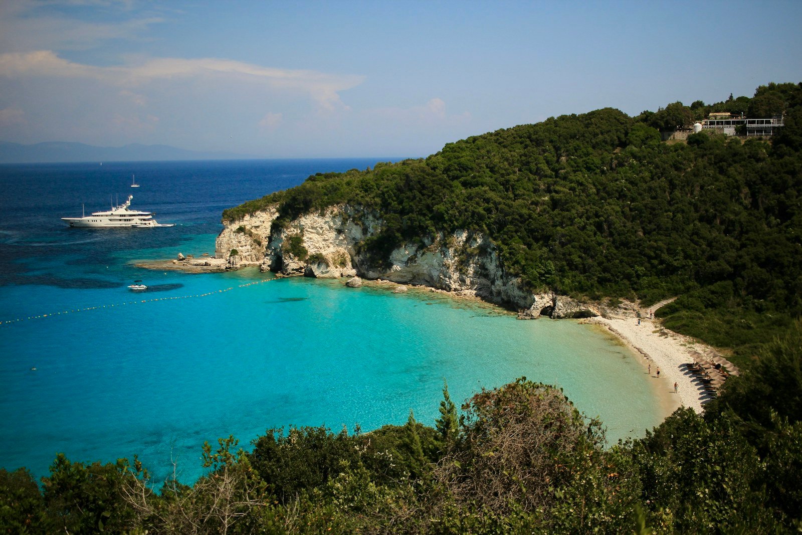 Yacht in a turquoise bay in Paxos